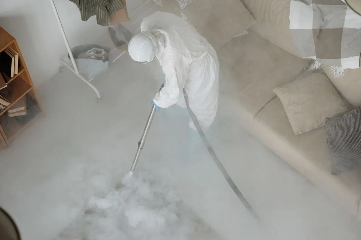 Biohazard cleanup technician in protective equipment, Farmington, MS